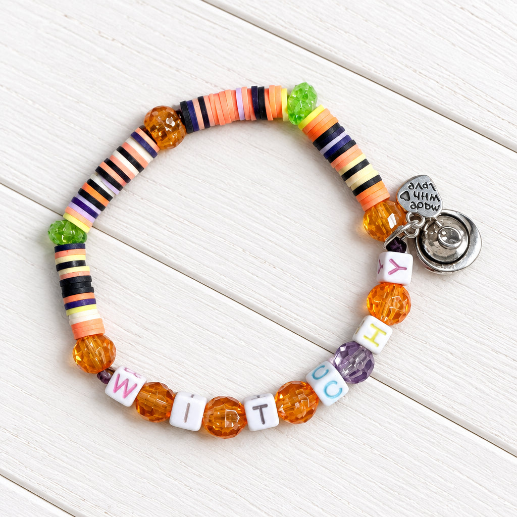Halloween bracelet with "Withcy" written on it 
